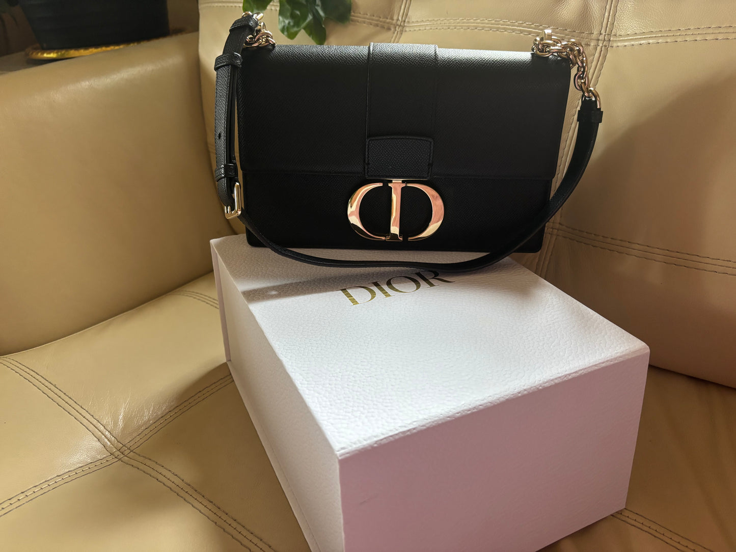 Dior 30 Montaigne bag in black box calfskin leather with a gold-finish metal CD clasp.
